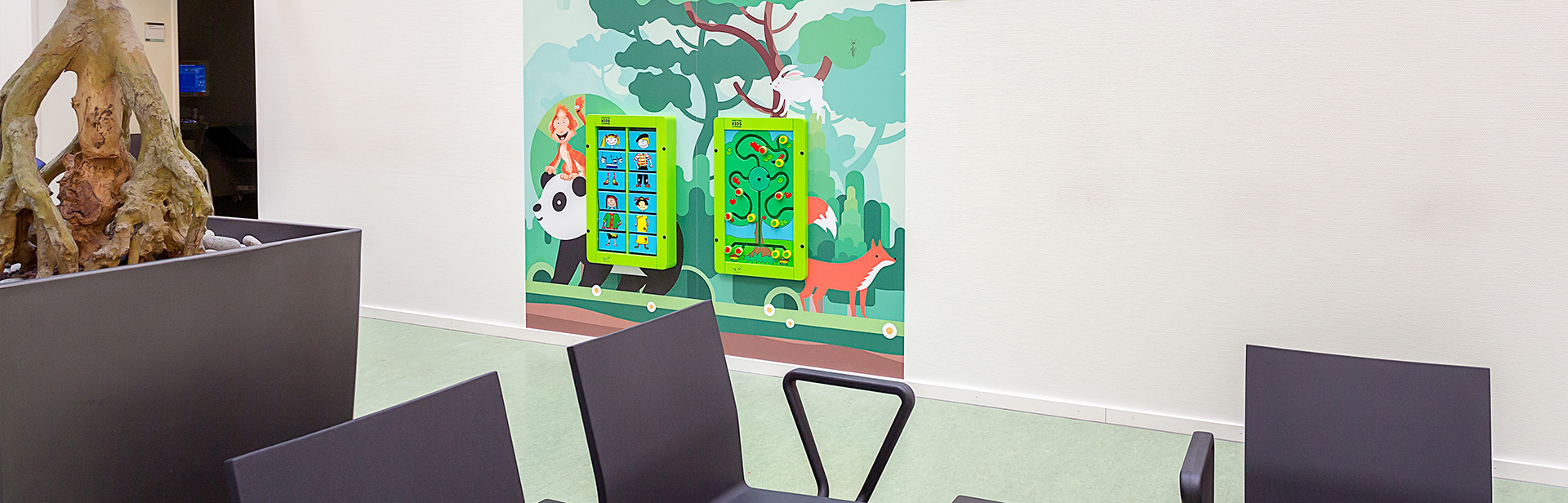 this image shows a kids corner with wall games in a hospital